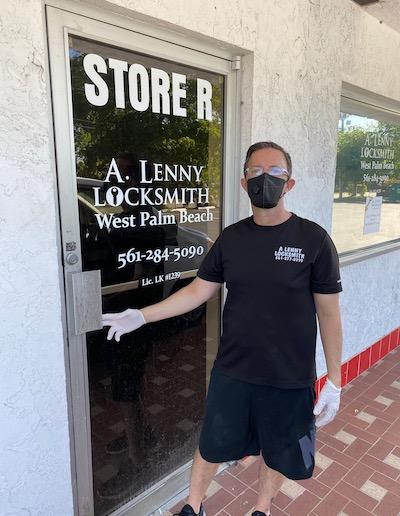 A Lenny Locksmith West Palm Beach Tech With Mask At Front Door